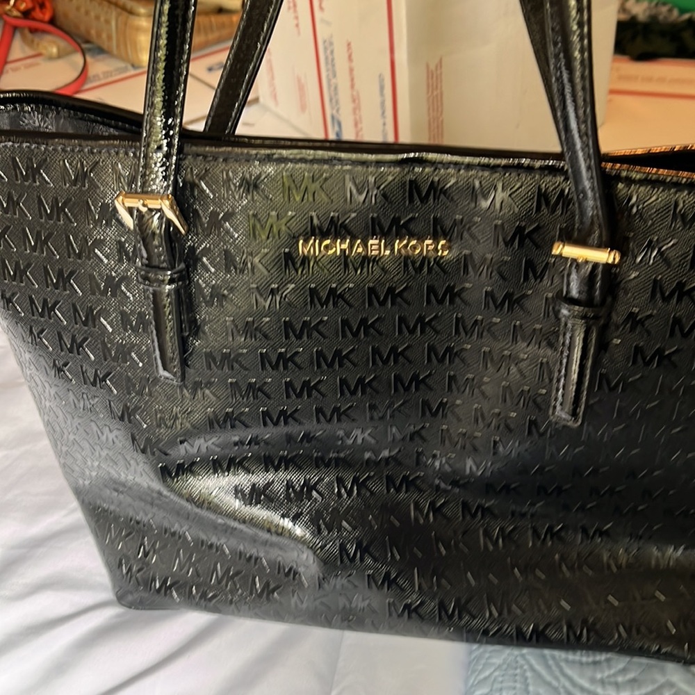 Michael Kors shiny black purse.